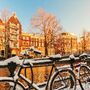 Bicycles covered with snow during winter in Amsterdam